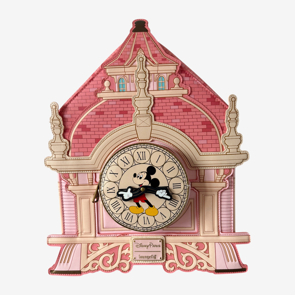Once Upon Magic pink faux leather clock bag with Mickey Mouse on the clock face, inspired by Disneyland Hotel architecture.
