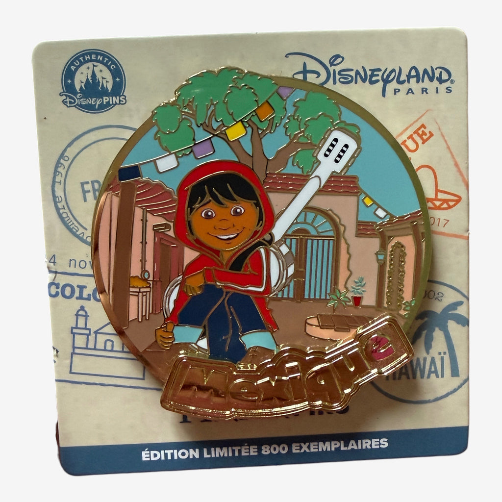 Once Upon Magic Disneyland Paris Miguel from Coco pin, featuring the character in a red hoodie and blue jeans, holding a guitar.