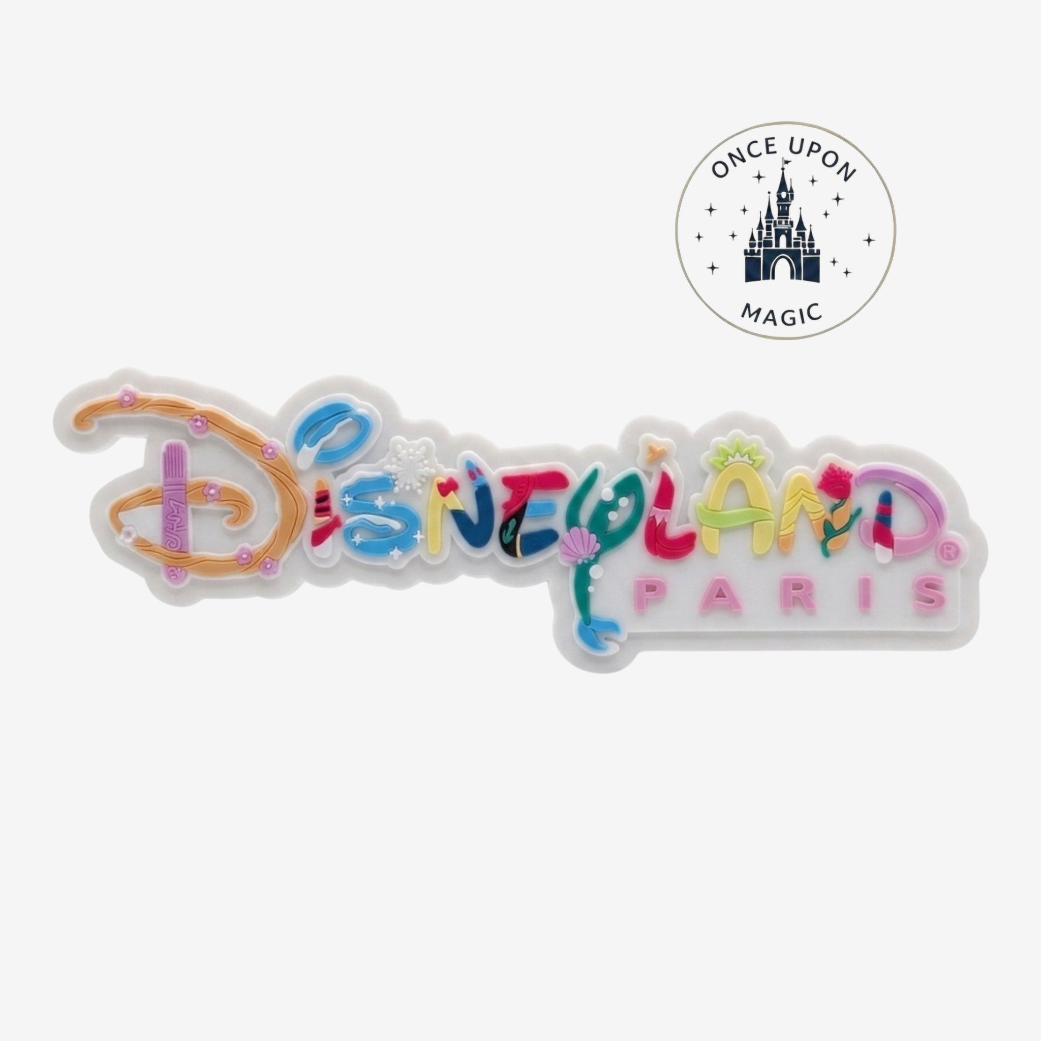 Once Upon Magic Disneyland Paris logo magnet with colorful, festive lettering and seasonal character motifs.