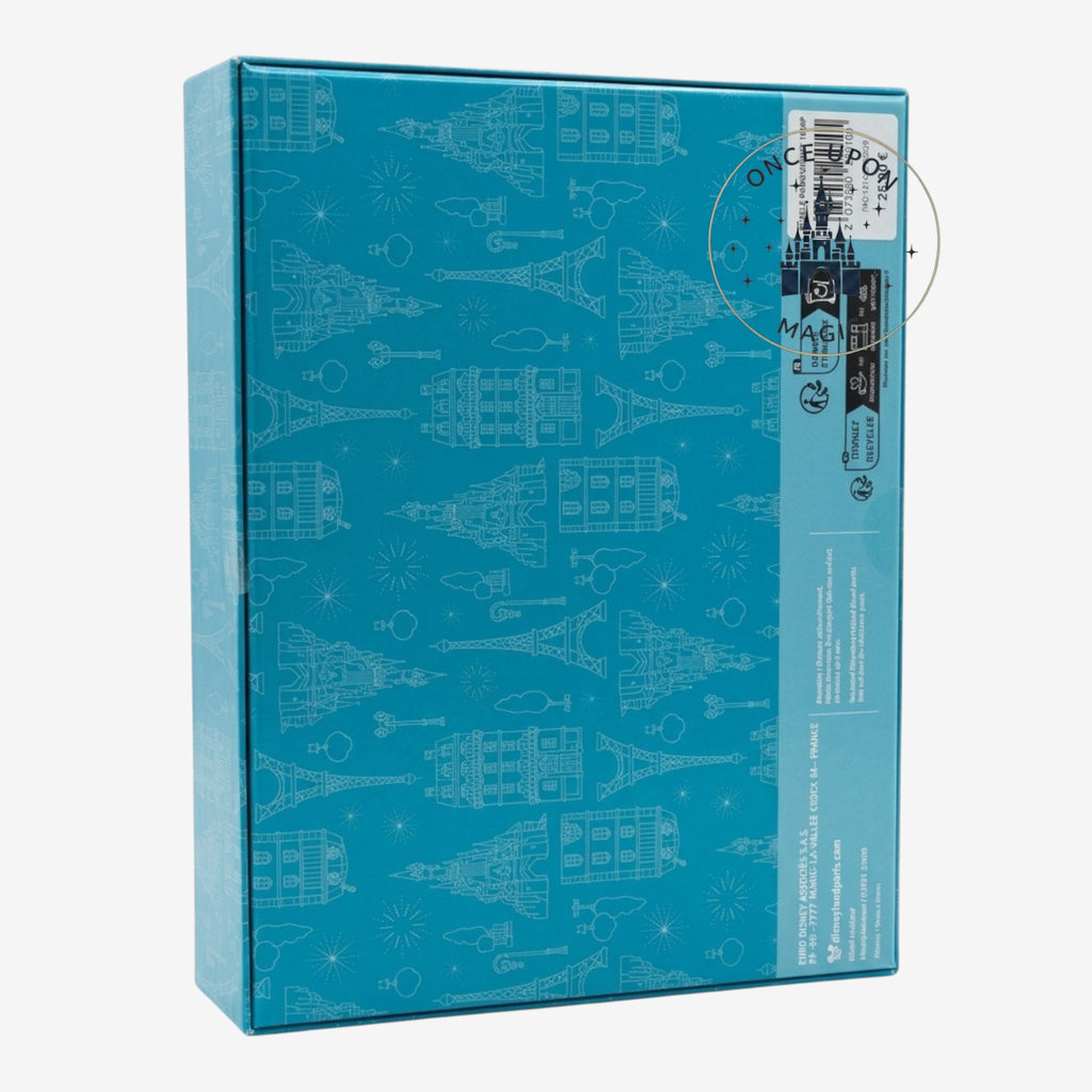 Once Upon Magic blue 1000-piece puzzle box featuring a repeating pattern of Parisian landmarks and fireworks.