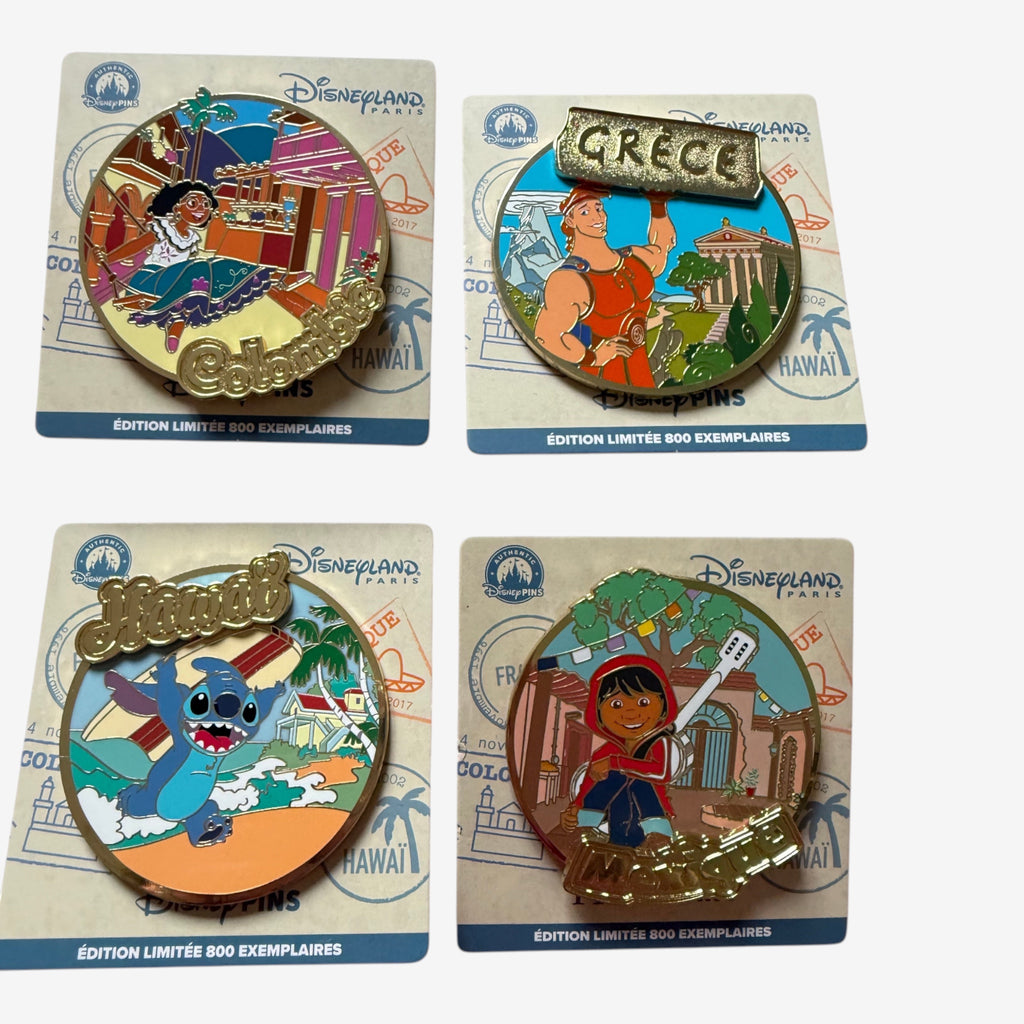 Once Upon Magic Disneyland Paris travel pins featuring characters from Colombia, Greece, Hawaii, and Mexico. Limited edition.
