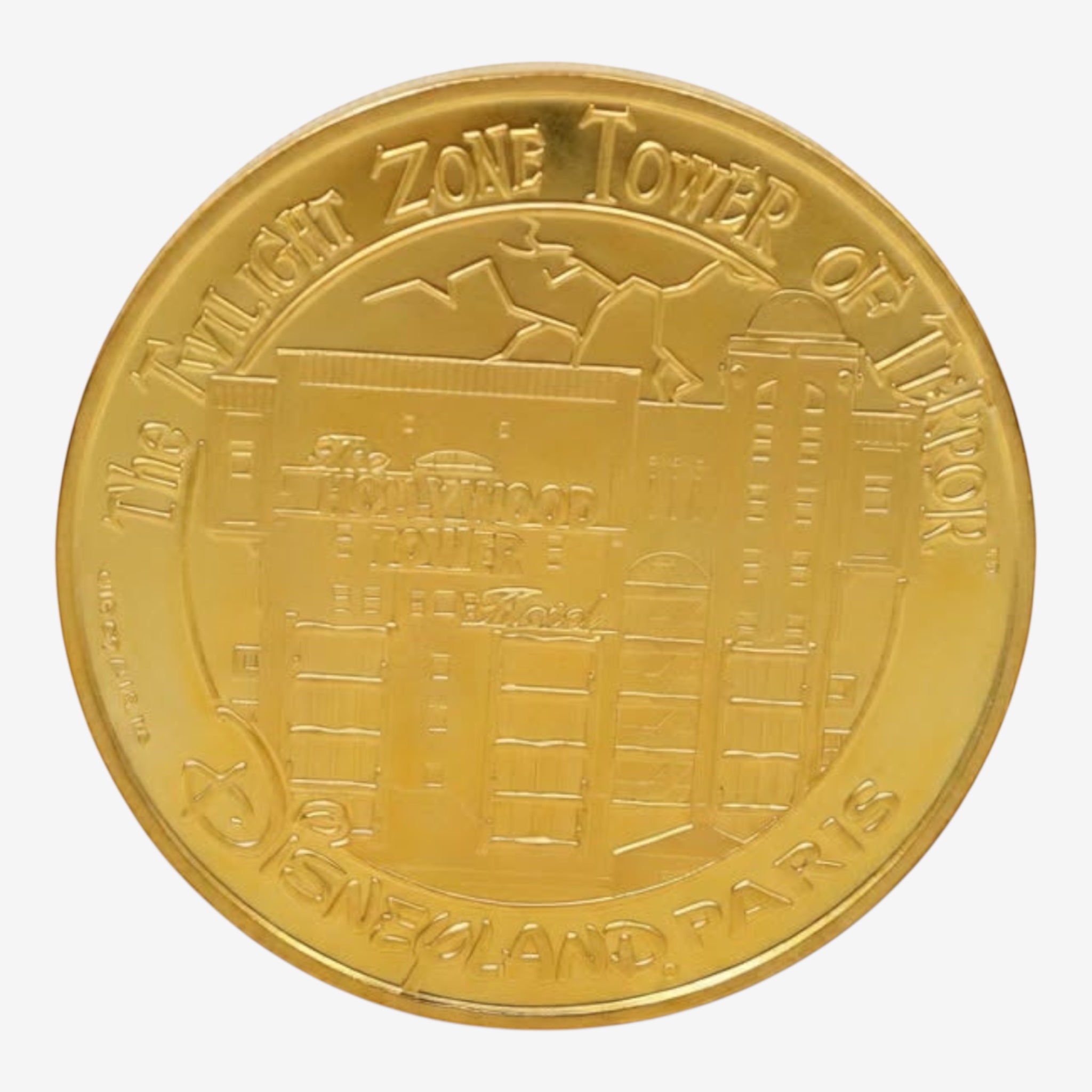 Once Upon Magic gold metal souvenir medal featuring The Twilight Zone Tower of Terror at Disneyland Paris
