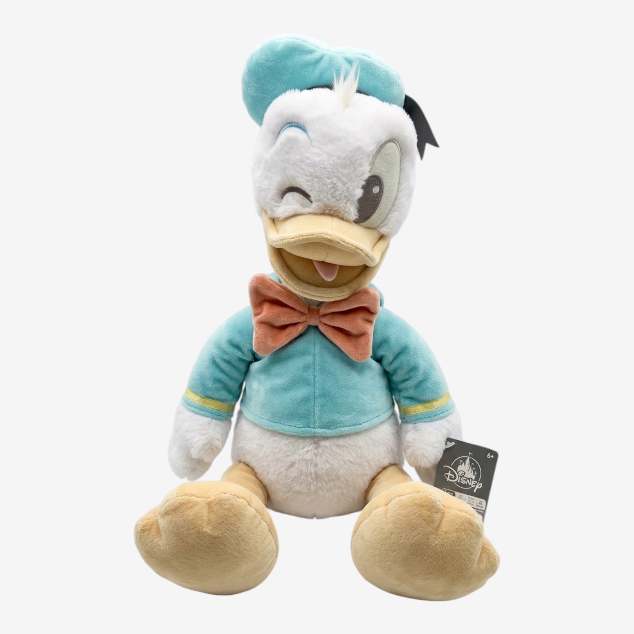 Once Upon Magic Donald Duck plush toy in teal sailor suit with peach bow tie, winking.
