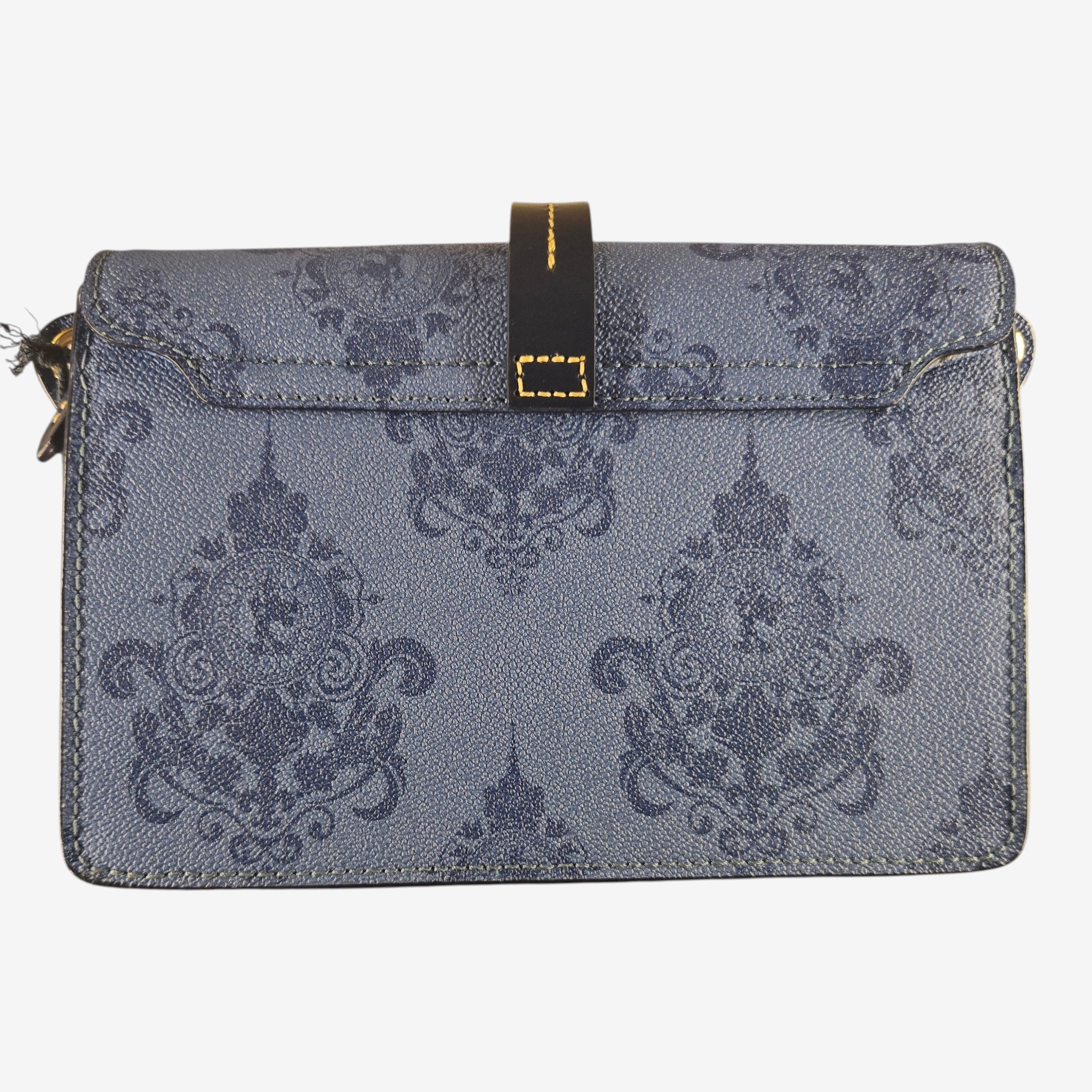Dooney & Bourke Disneyland Hotel limited edition crossbody bag in midnight blue with baroque print and gold buckle closure.