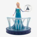 Once Upon Magic Elsa Ice Castle Balcony Figurine, Queen Elsa in ice blue gown on a balcony with snowflake base.