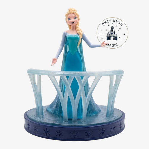 Once Upon Magic Elsa Ice Castle Balcony Figurine, Queen Elsa in ice blue gown on a balcony with snowflake base.