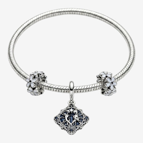 Once Upon Magic sterling silver charm bracelet with Anna & Elsa pendant, blue crystals, and floral charms.