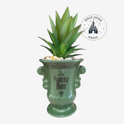 Once Upon Magic green ceramic planter with Phantom Manor text and faux succulent plant.