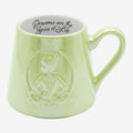 Once Upon Magic light green ceramic mug with embossed princess and "Dreams are the Spice of Life" quote inside.