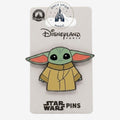 Once Upon Magic Star Wars Grogu enamel pin in cartoon style, wearing a tan robe. Features large ears and big eyes.