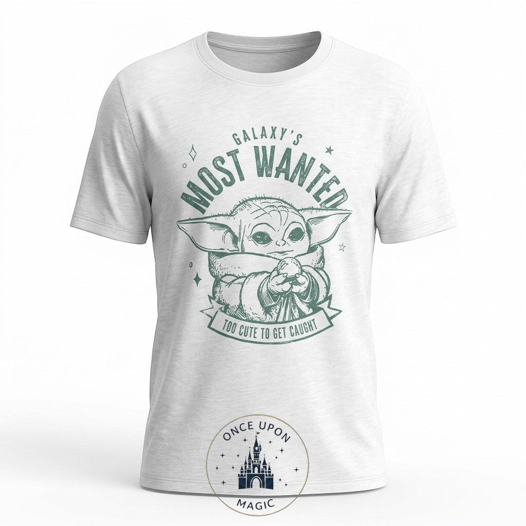 Once Upon Magic white cotton t-shirt with Grogu graphic and "Galaxy's Most Wanted – Too Cute To Get Caught" text.