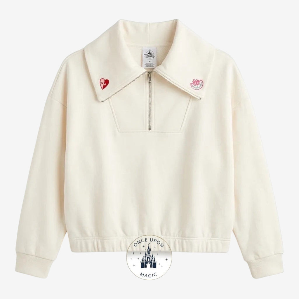 Once Upon Magic Alice in Wonderland ivory half-zip sweatshirt with oversized collar, embroidered heart detail, and playful back graphic.