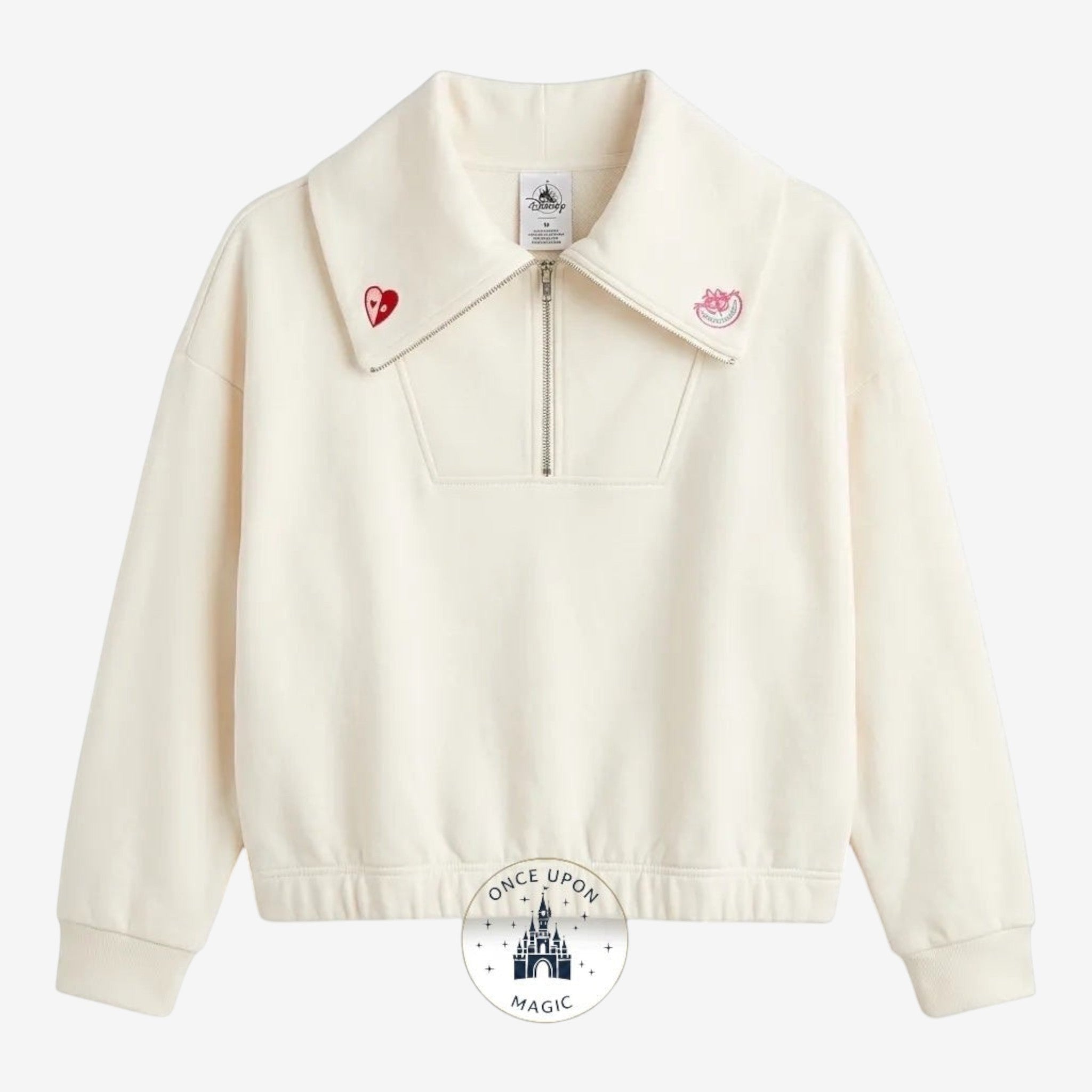 Once Upon Magic Alice in Wonderland ivory half-zip sweatshirt with oversized collar, embroidered heart detail, and playful back graphic.