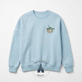Once Upon Magic light blue crewneck sweatshirt with embroidered Grogu from The Mandalorian on the left chest.