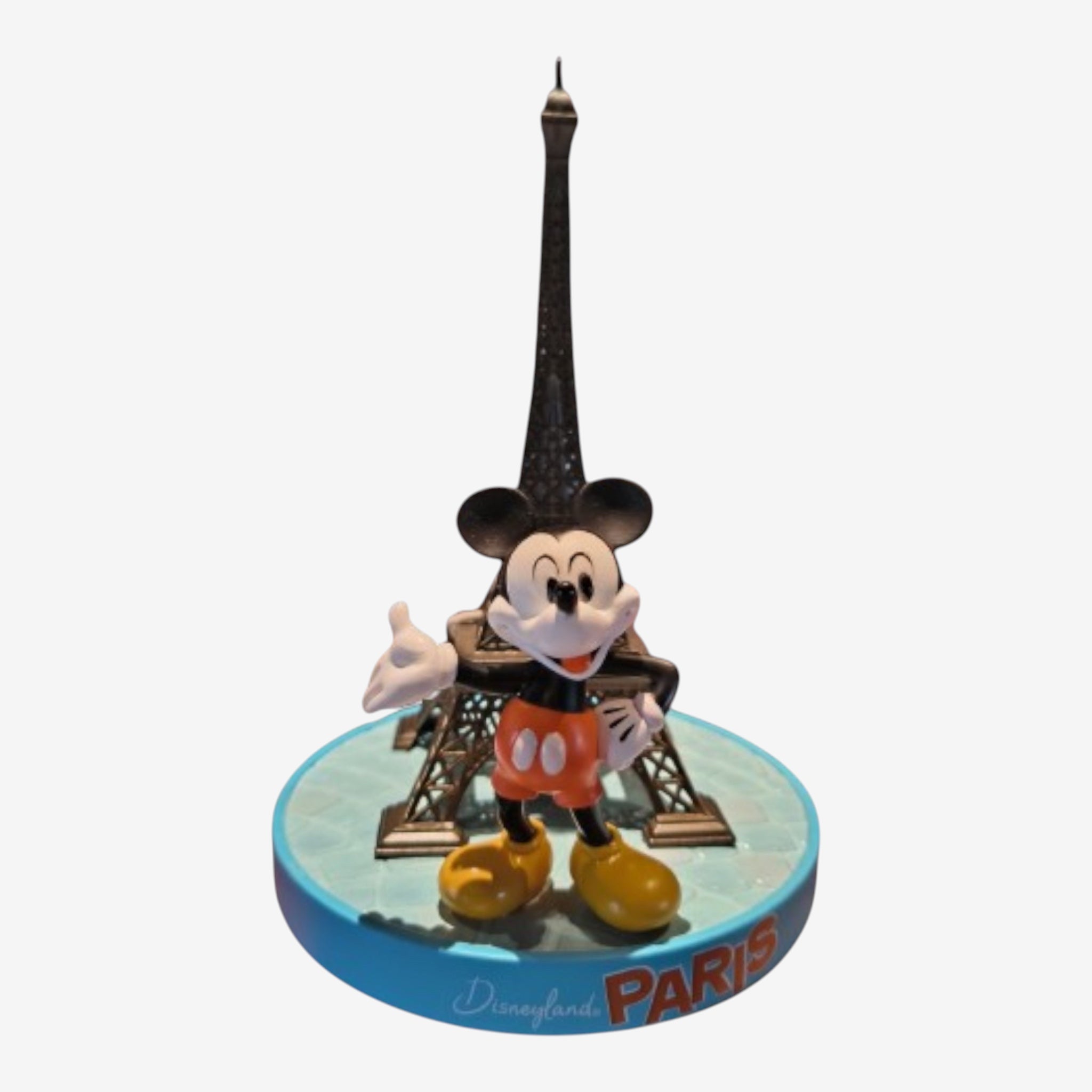 Once Upon Magic Mickey Mouse figurine with Eiffel Tower, wearing orange shorts and yellow shoes, on a blue base with 'Disneyland Paris' text.
