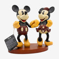 Once Upon Magic Mickey and Minnie Mouse figurine in classic outfits on a wooden base. Detailed collectible for Disney fans.