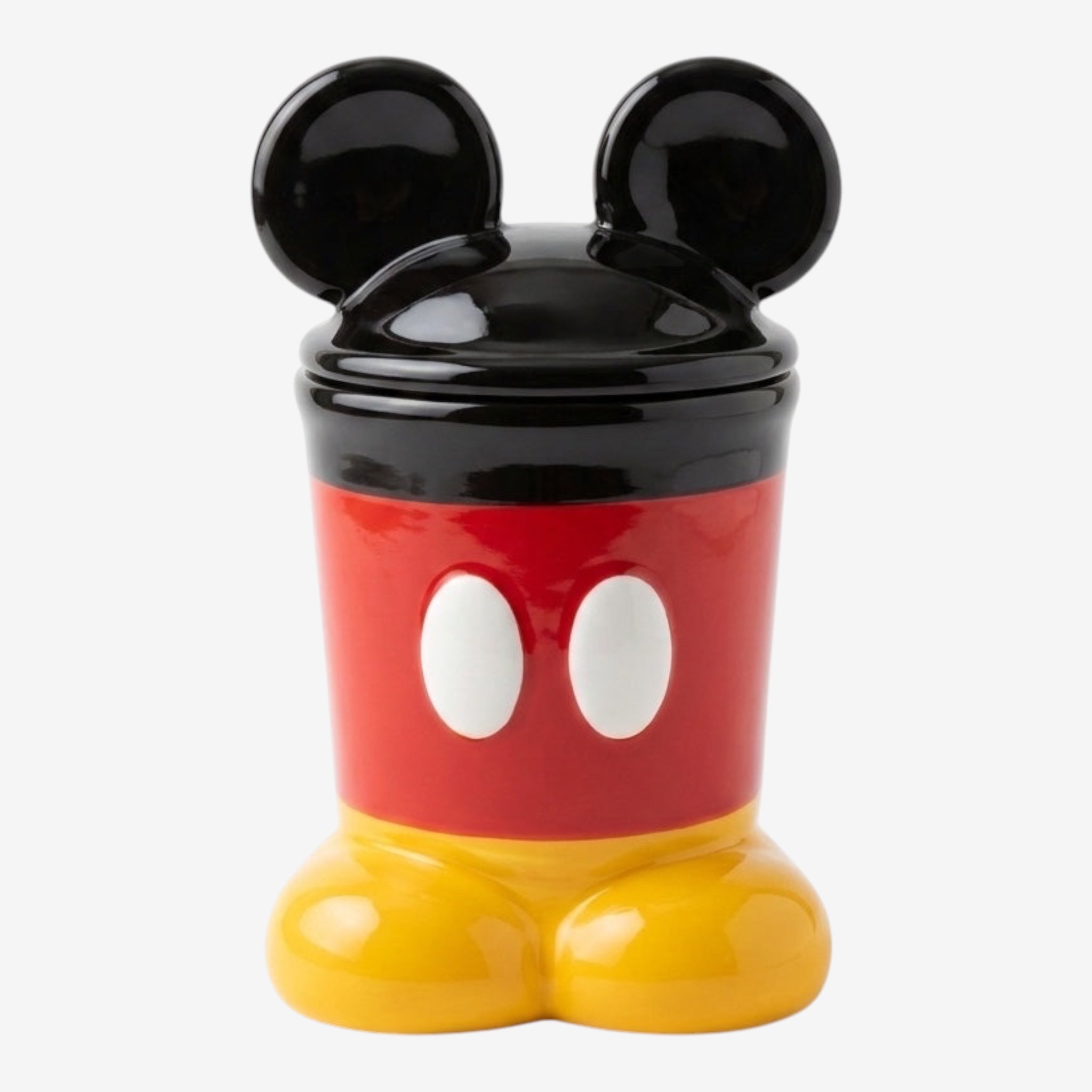 Once Upon Magic Mickey Mouse inspired ceramic treat jar with black ears, red shorts, and yellow shoes. Features white buttons.
