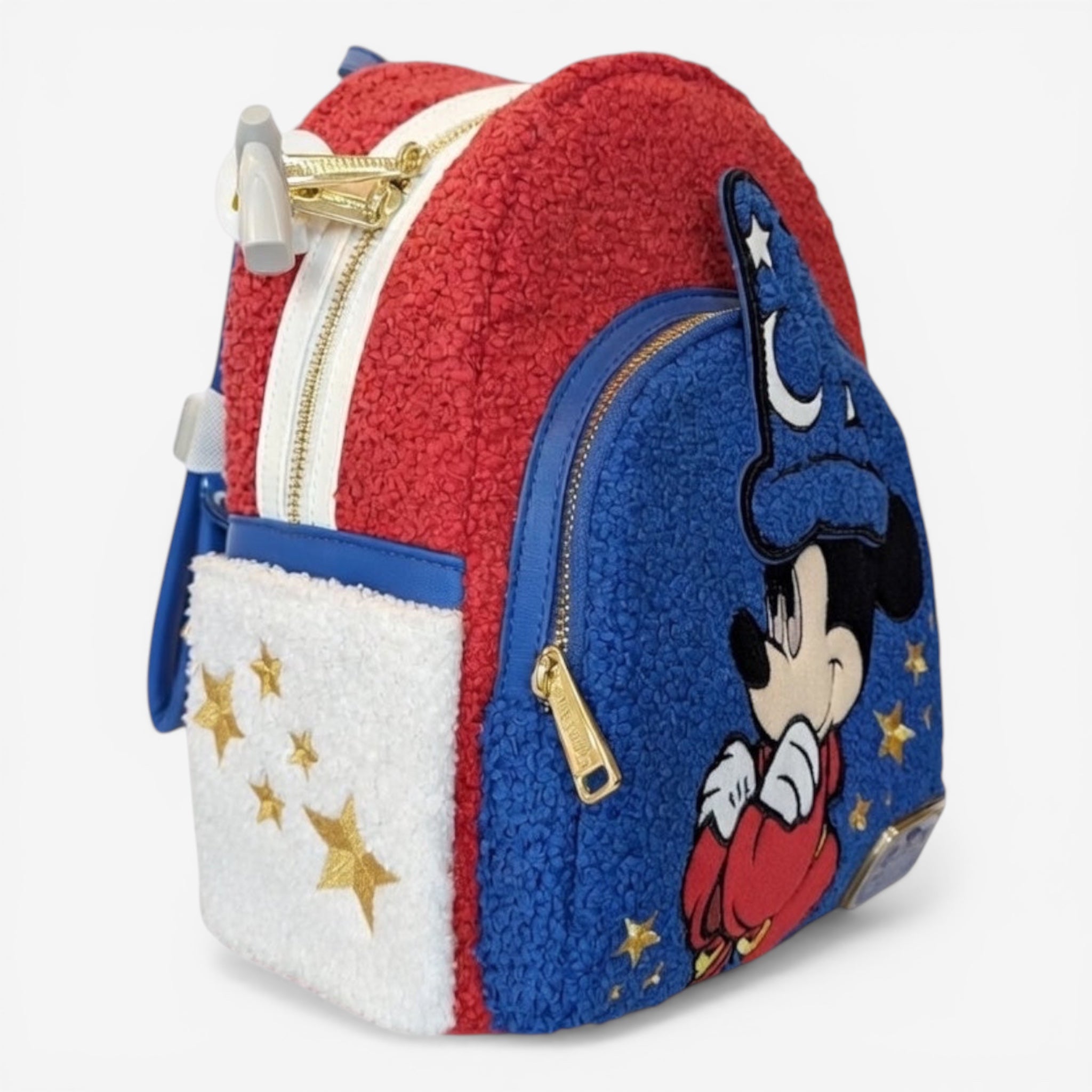 Once Upon Magic red, blue, and white fuzzy mini backpack with Mickey Mouse as the Sorcerer's Apprentice and gold stars.