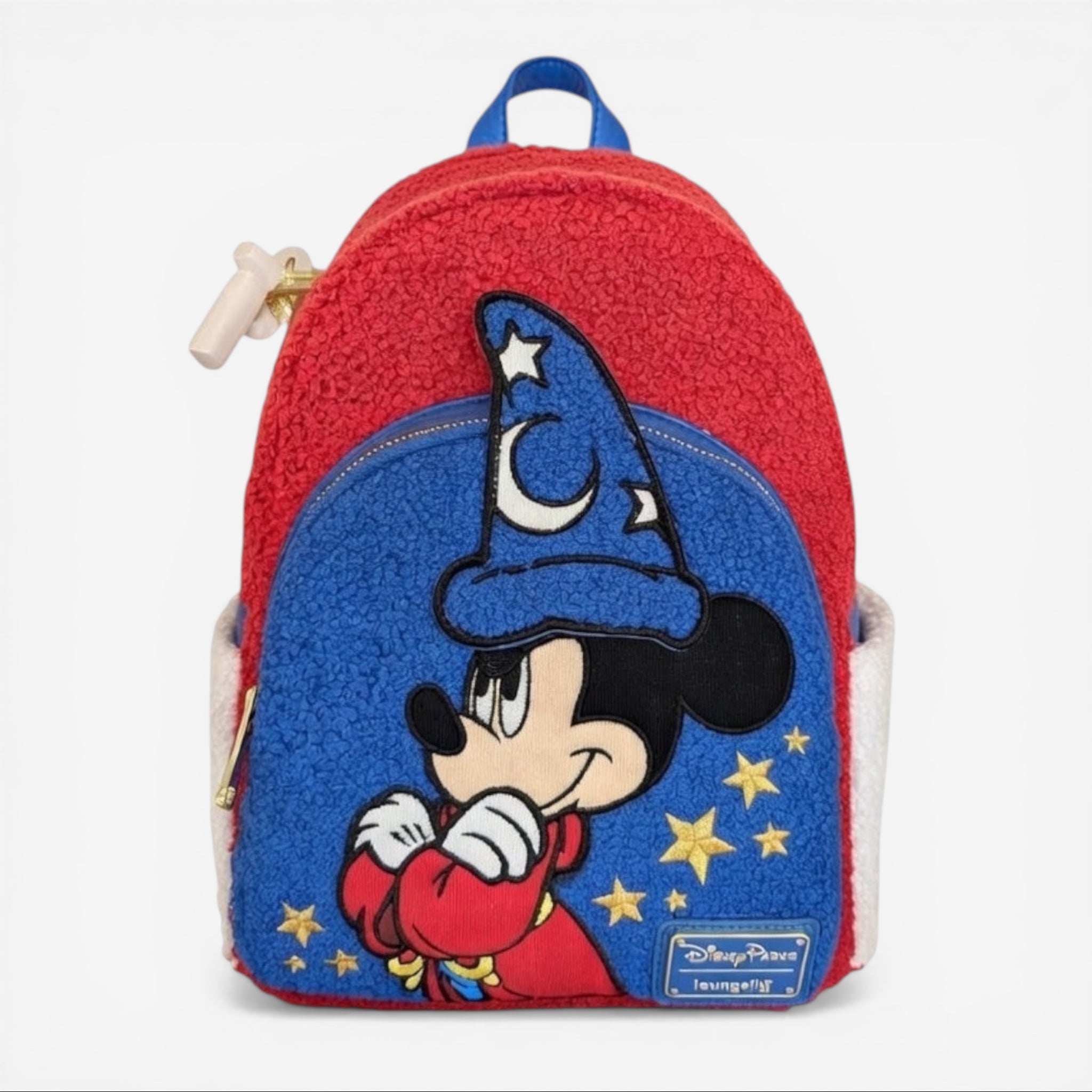 Once Upon Magic red and blue mini backpack with Mickey Mouse as the Sorcerer's Apprentice, gold stars, and fuzzy texture.