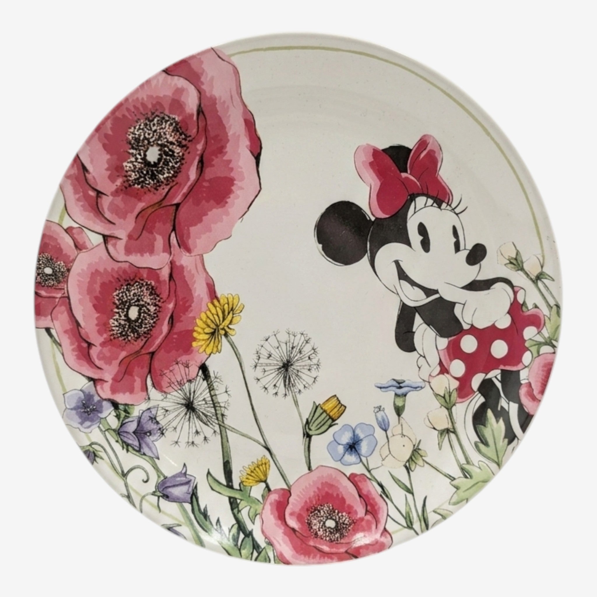 Once Upon Magic plate featuring Minnie Mouse in a field of pink poppies and wildflowers. Minnie wears her iconic red bow and polka dot dress.