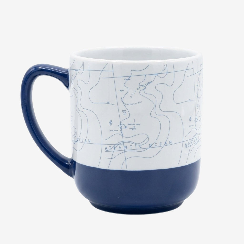 Once Upon Magic Newport Bay Club ceramic mug with navy blue handle and base, featuring a nautical map design.
