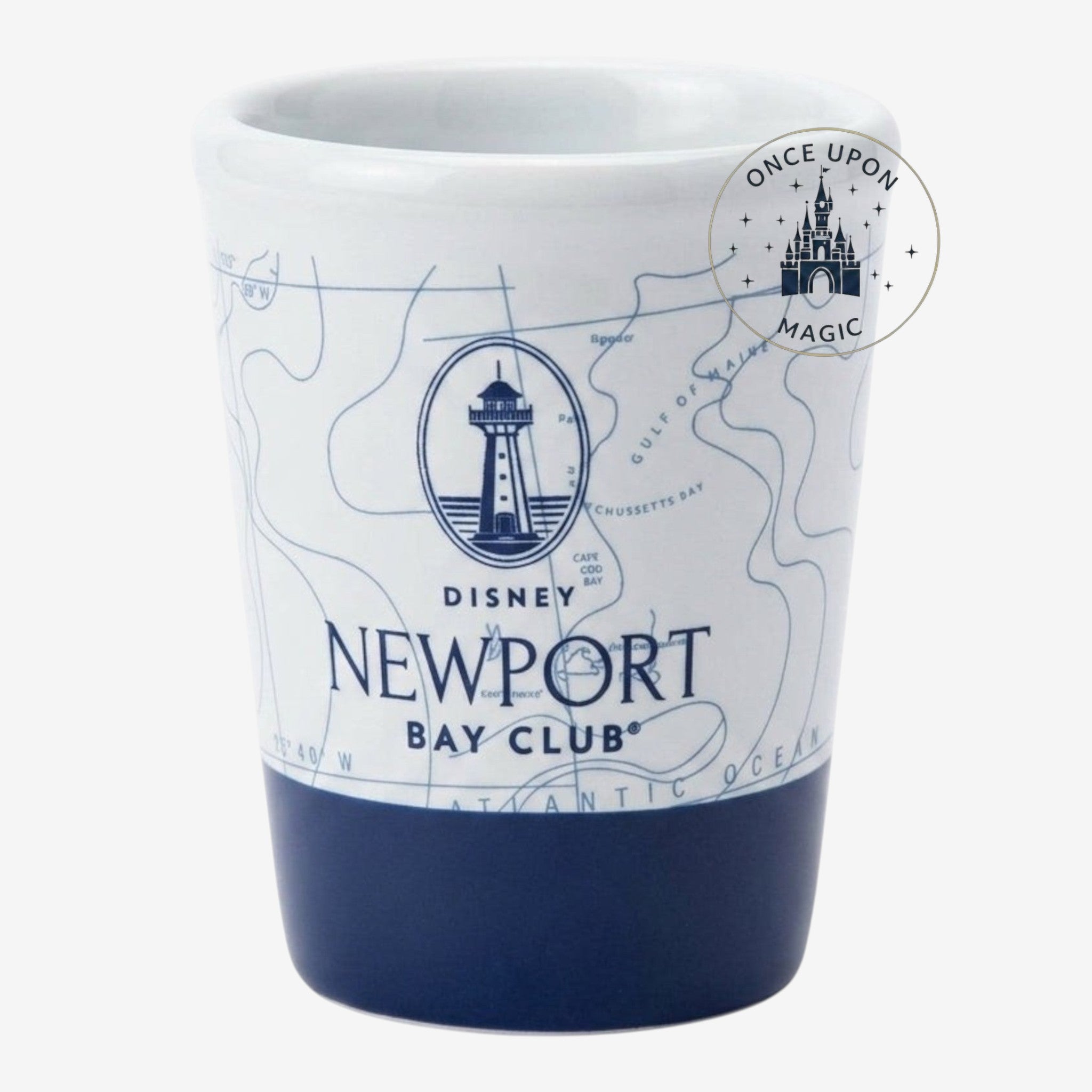 Once Upon Magic white ceramic Nespresso cup with navy blue base, featuring a nautical map design and Newport Bay Club logo with lighthouse.