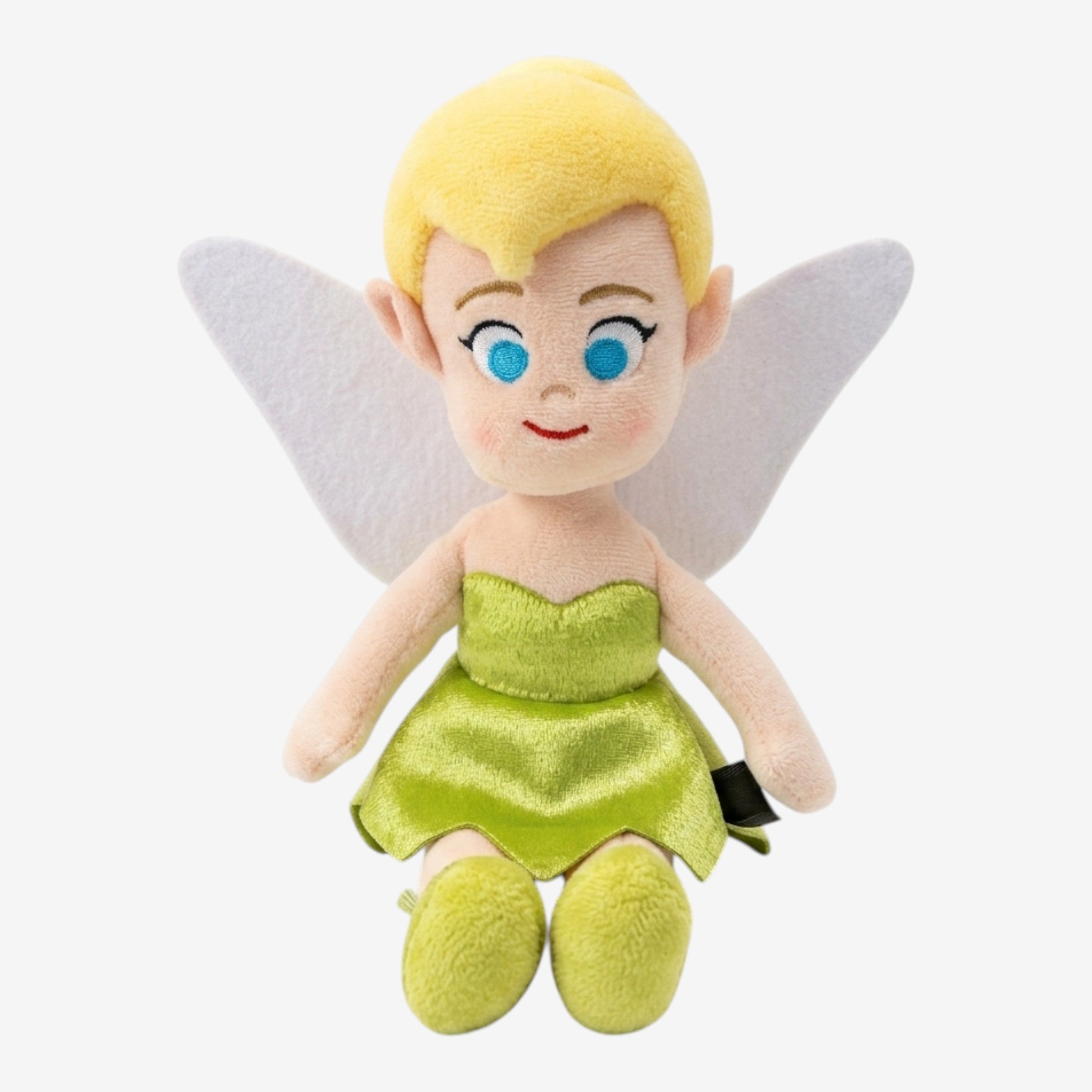 Peluche Clochette Once Upon Magic, robe verte, ailes blanches, cheveux blonds, yeux bleus, souriante, style enfantin.