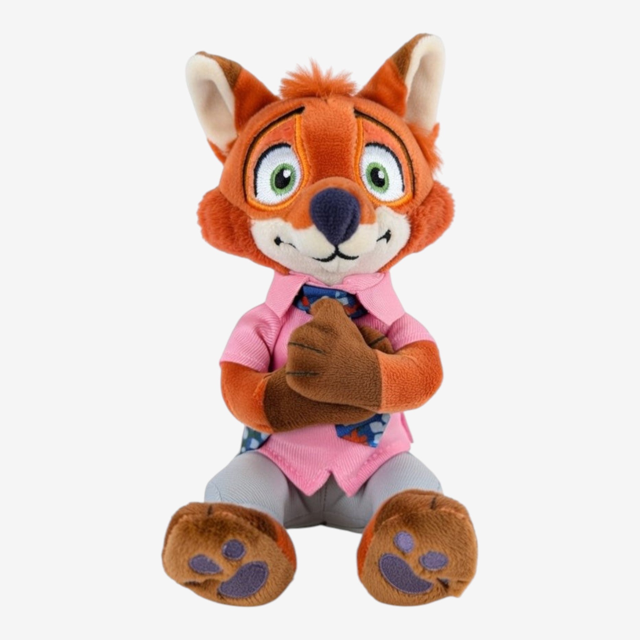 Peluche d'épaule Nick Wilde Zootopie Disneyland Paris, renard roux en chemise rose et pantalon gris, yeux verts, pose assise.