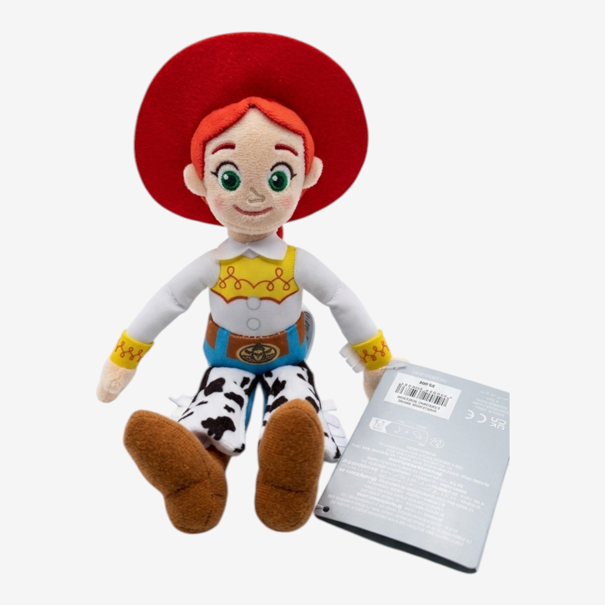 Peluche Jessie Toy Story, chapeau rouge, chemise blanche, gilet jaune, pantalon à motif vache, pour enfants et collectionneurs.