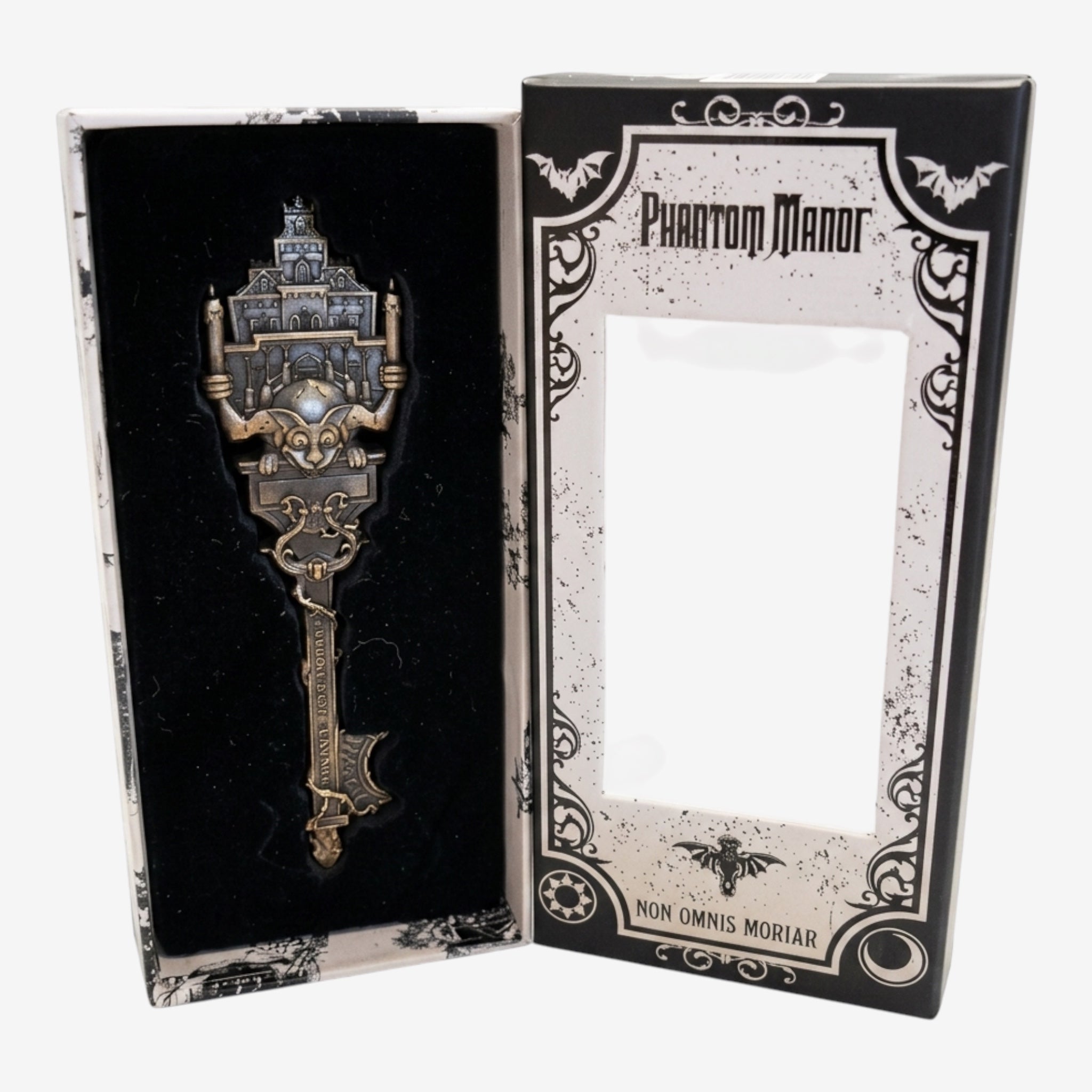 Once Upon Magic Phantom Manor attraction key, gothic metallic design, presented in a decorative box.