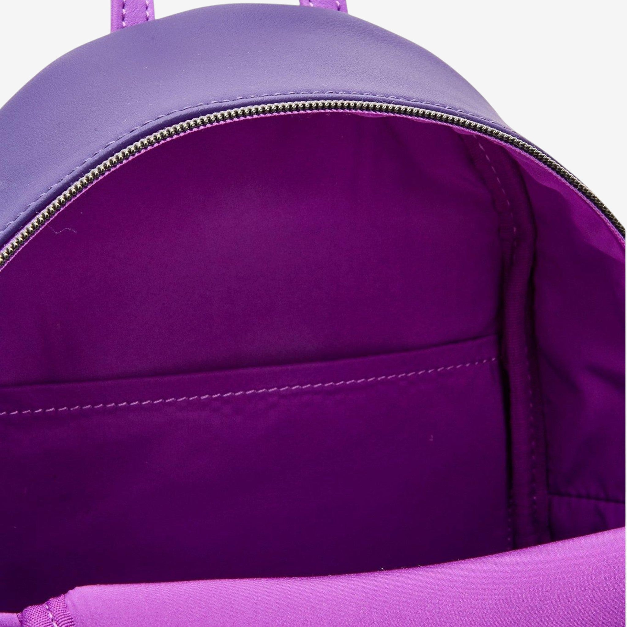 Once Upon Magic Loungefly Alice in Wonderland mini backpack, purple polyurethane with interior pocket.