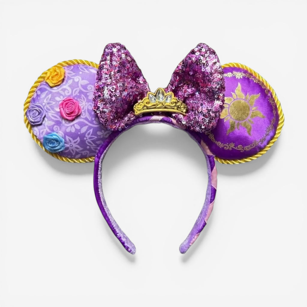 Once Upon Magic purple Minnie ears headband with sequined bow and golden crown, inspired by Rapunzel.