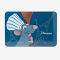 Once Upon Magic Ratatouille Remy placemat featuring the chef rat in a chef's hat holding a wooden spoon, with Eiffel Tower outlines and Disneyland Paris logo.