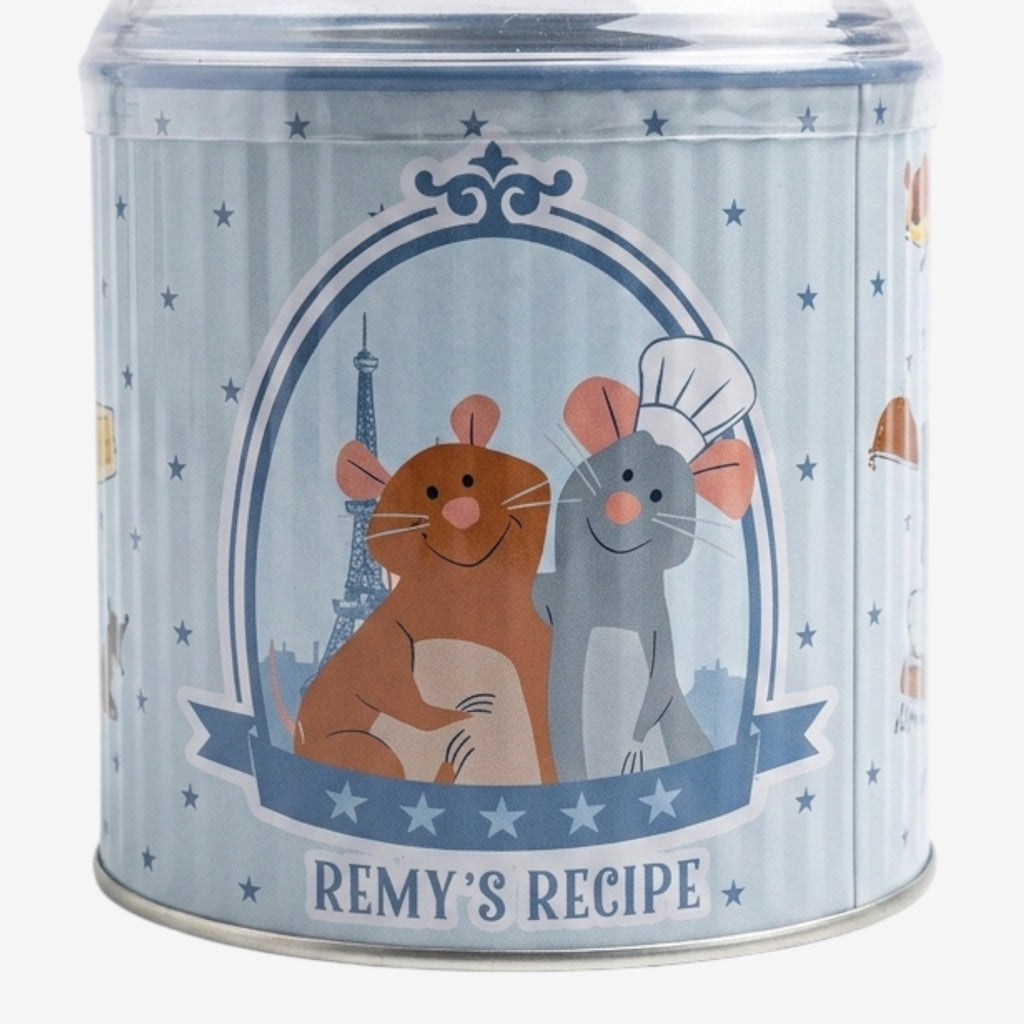 Once Upon Magic Ratatouille themed tin featuring Remy and Emile with Eiffel Tower illustration. Blue tin with white stripes and stars.
