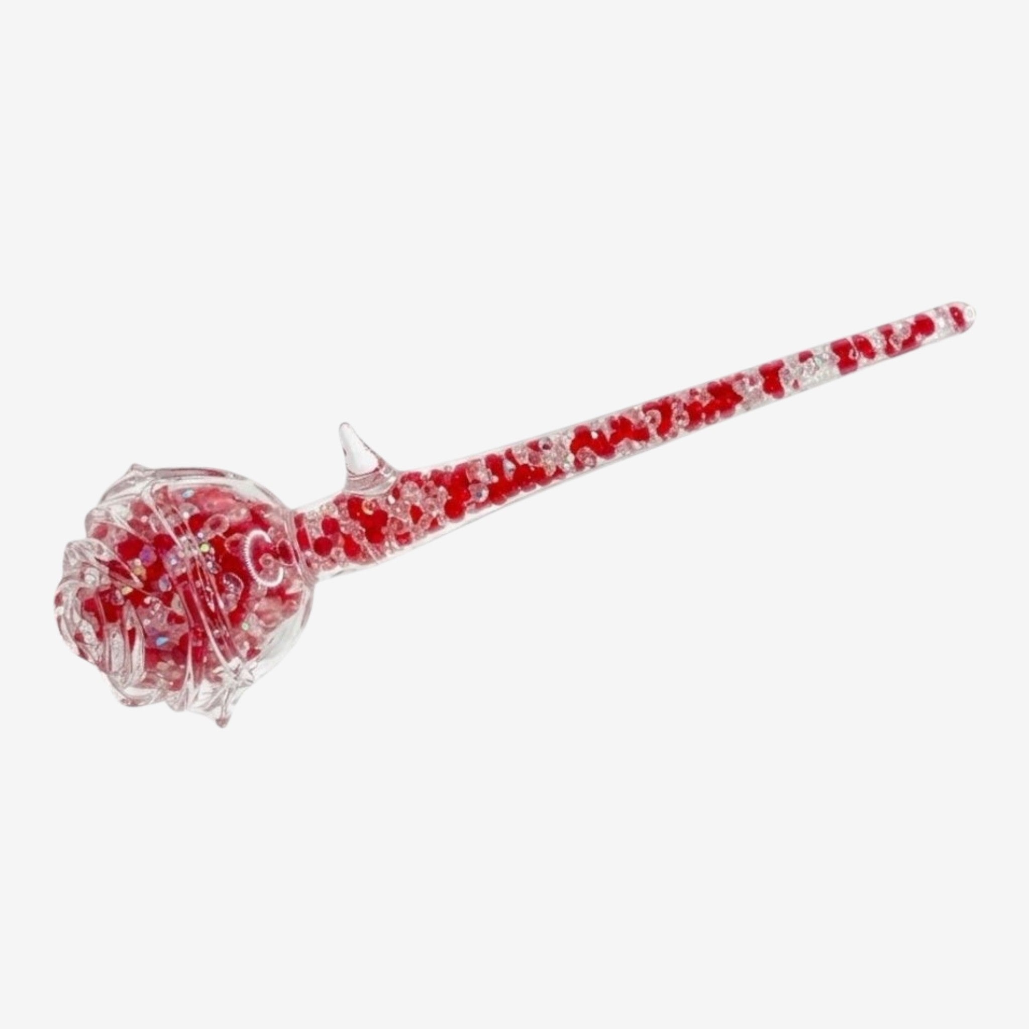 Once Upon Magic pipe à main en verre transparent en forme de rose avec paillettes rouges scintillantes. Design floral détaillé.