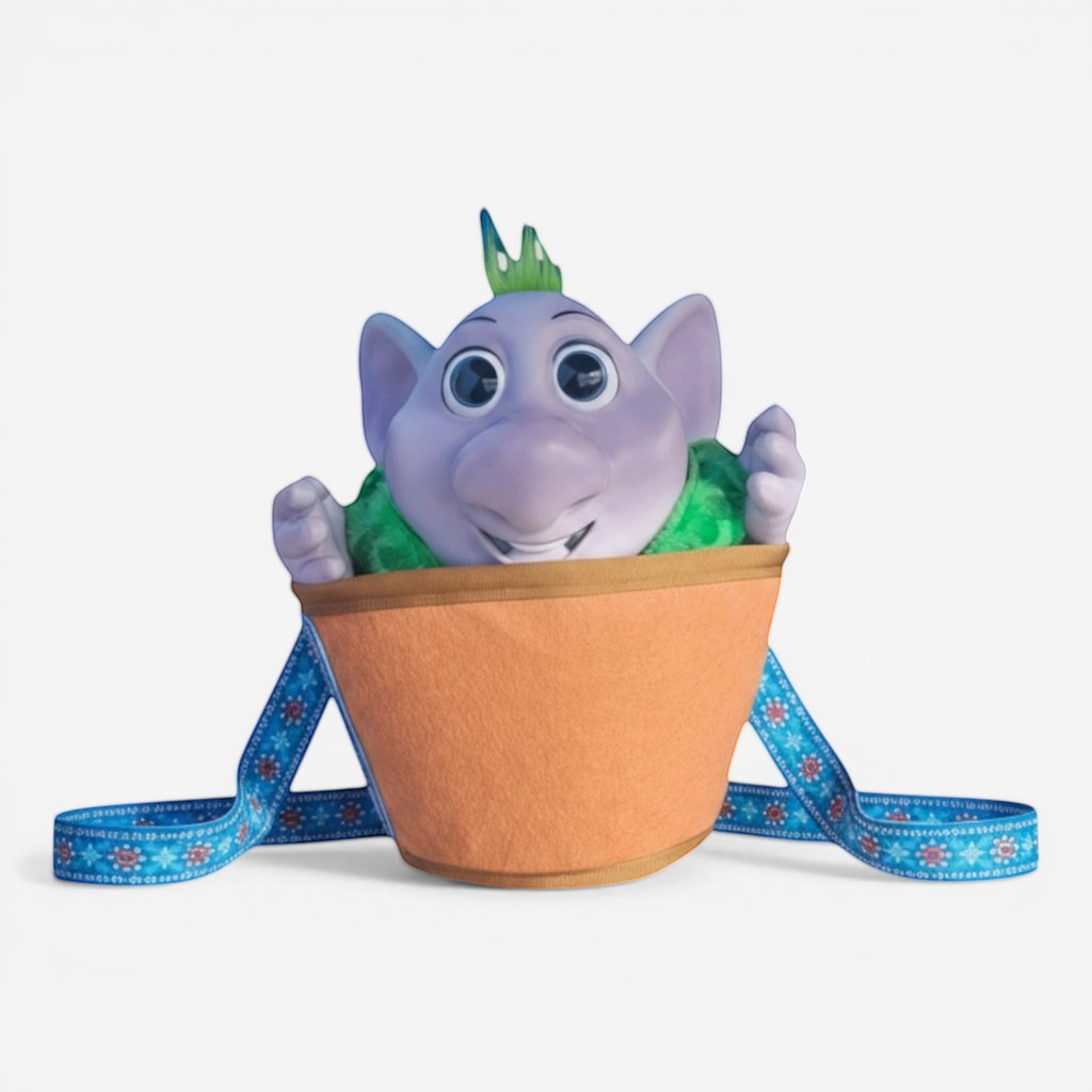 Once Upon Magic Runa interactive plush character from Frozen, purple troll in orange bucket with blue patterned straps.