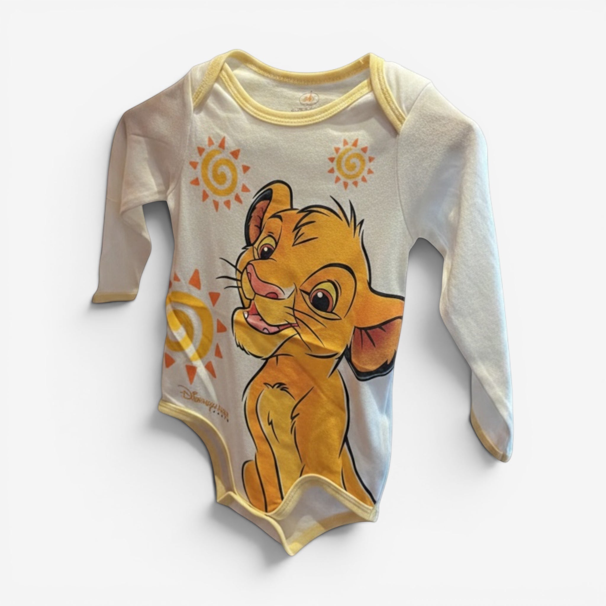 Once Upon Magic white long-sleeve baby bodysuit with Simba graphic and yellow trim. Features sun graphics.