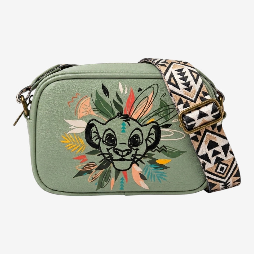 Once Upon Magic green faux leather crossbody bag featuring a Simba illustration with tribal-inspired foliage and a patterned strap.