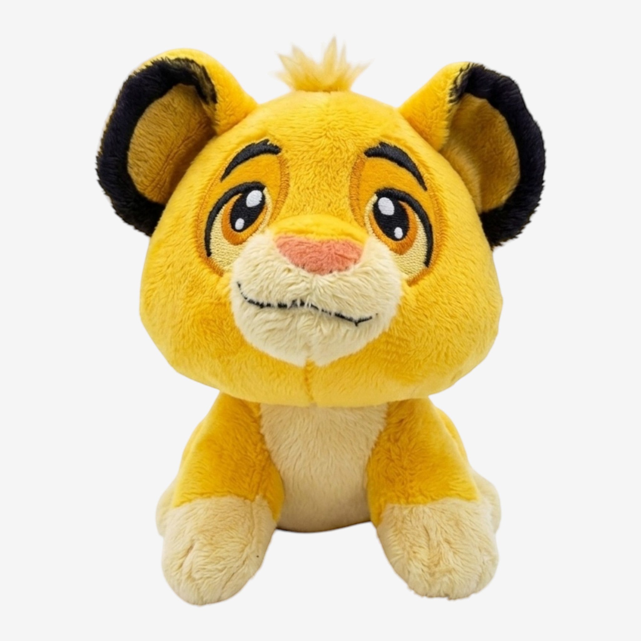 Once Upon Magic The Lion King Simba plush toy, vibrant yellow, soft huggable material, iconic playful expression, big eyes, mischievous smile.