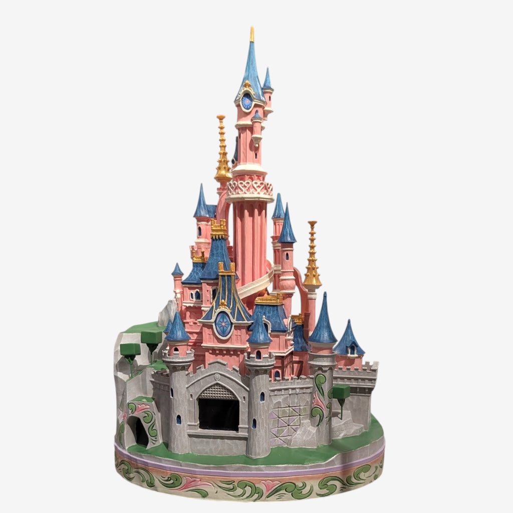 Once Upon Magic Disneyland Paris Sleeping Beauty Castle figurine by Jim Shore. Pink castle with blue roofs and gold accents.