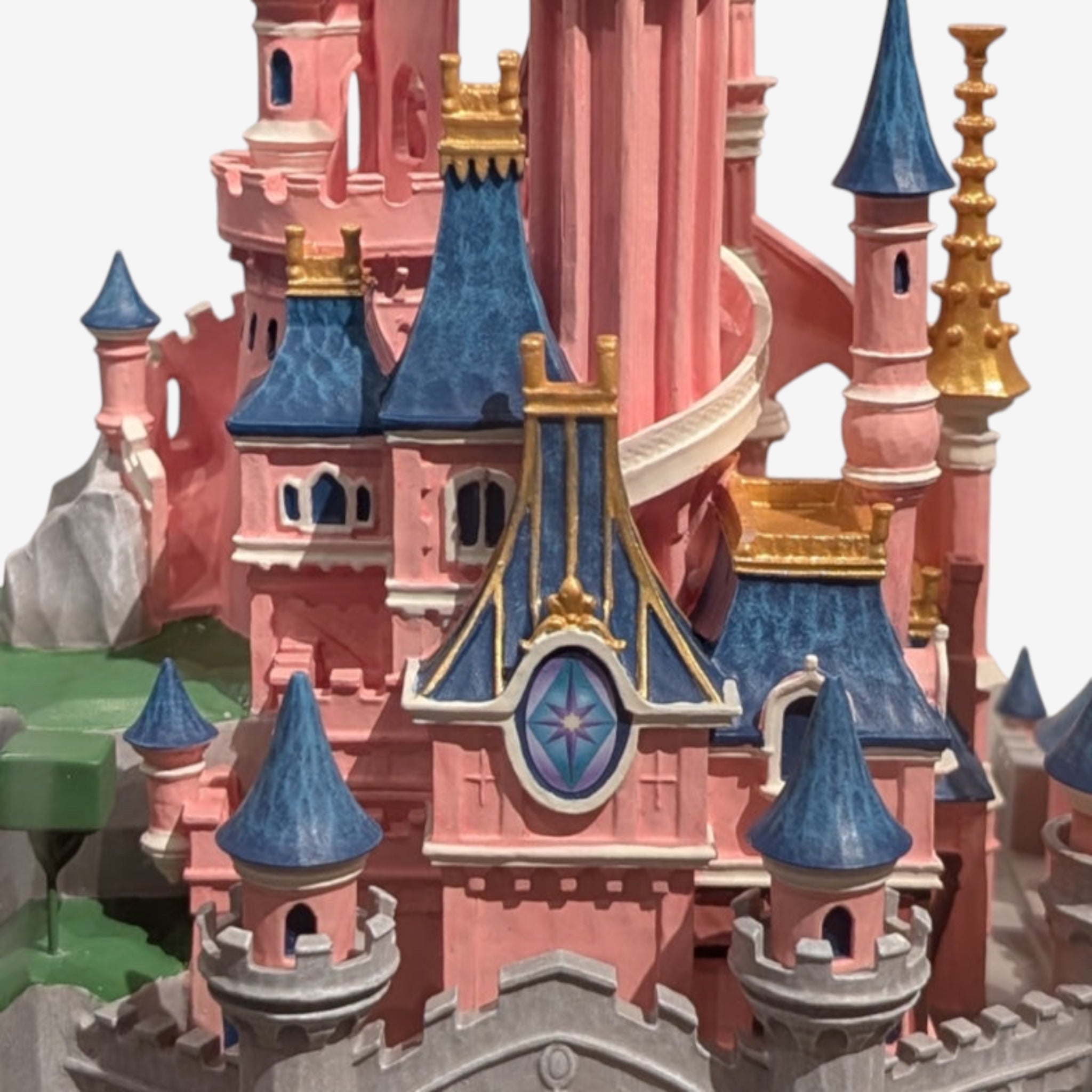 Once Upon Magic Disneyland Paris Sleeping Beauty Castle figurine by Jim Shore. Pink castle with blue roofs, gold accents, and floral base.