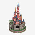 Once Upon Magic Disneyland Paris Sleeping Beauty Castle figurine by Jim Shore. Pink castle with blue roofs, gold accents, and floral base.