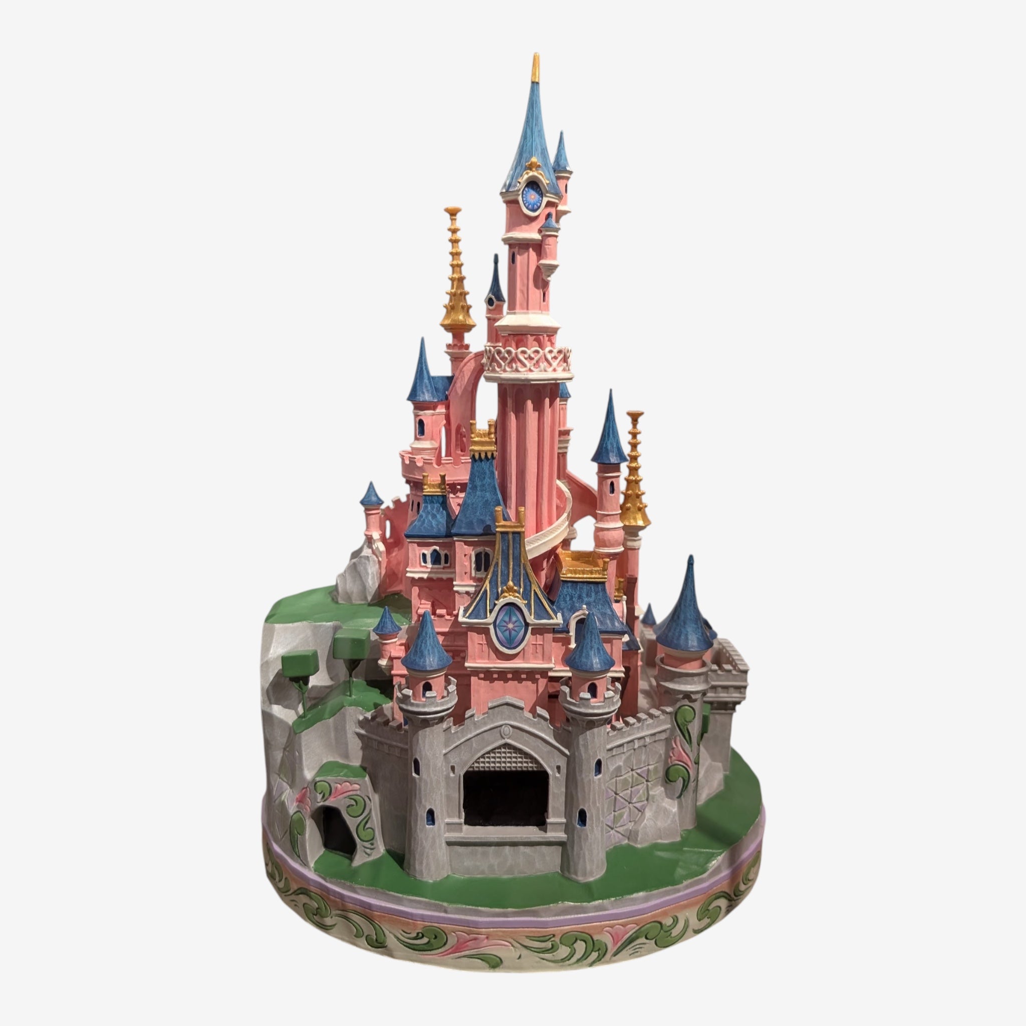 Once Upon Magic Disneyland Paris Sleeping Beauty Castle figurine by Jim Shore. Pink castle with blue roofs, gold accents, and floral base.