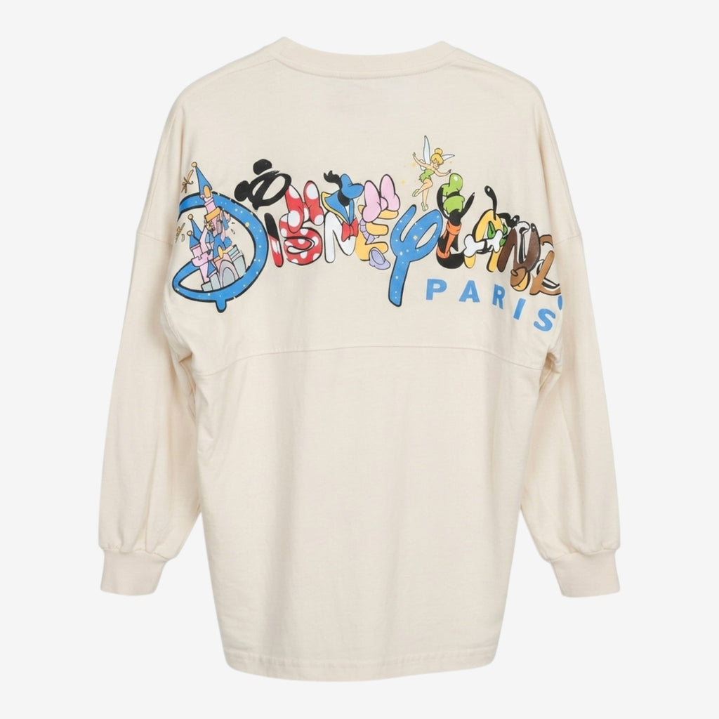 Spirit Jersey Disneyland Paris crème avec logo "Est. 1992" et personnages Disney au dos. Coupe ample et confortable.