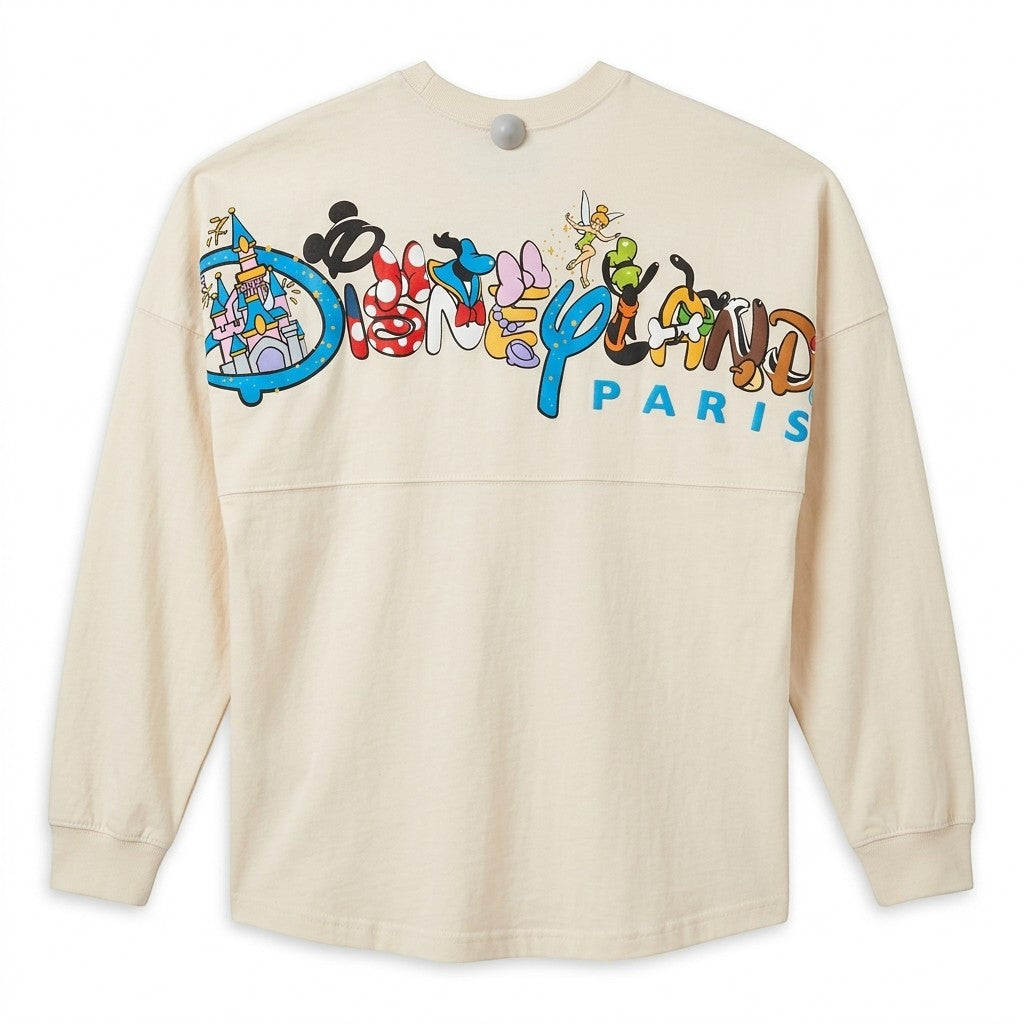 Spirit Jersey Disneyland Paris crème avec logo "Est. 1992" et personnages Disney iconiques au dos. Coupe ample, 100% coton.