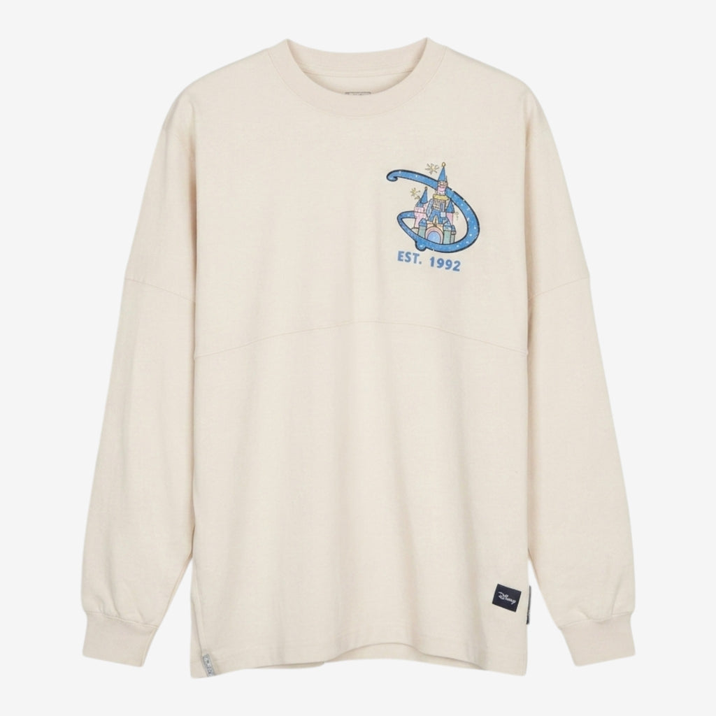 Spirit Jersey Disneyland Paris crème avec château et inscription Est. 1992 sur la poitrine. Coupe ample et confortable.