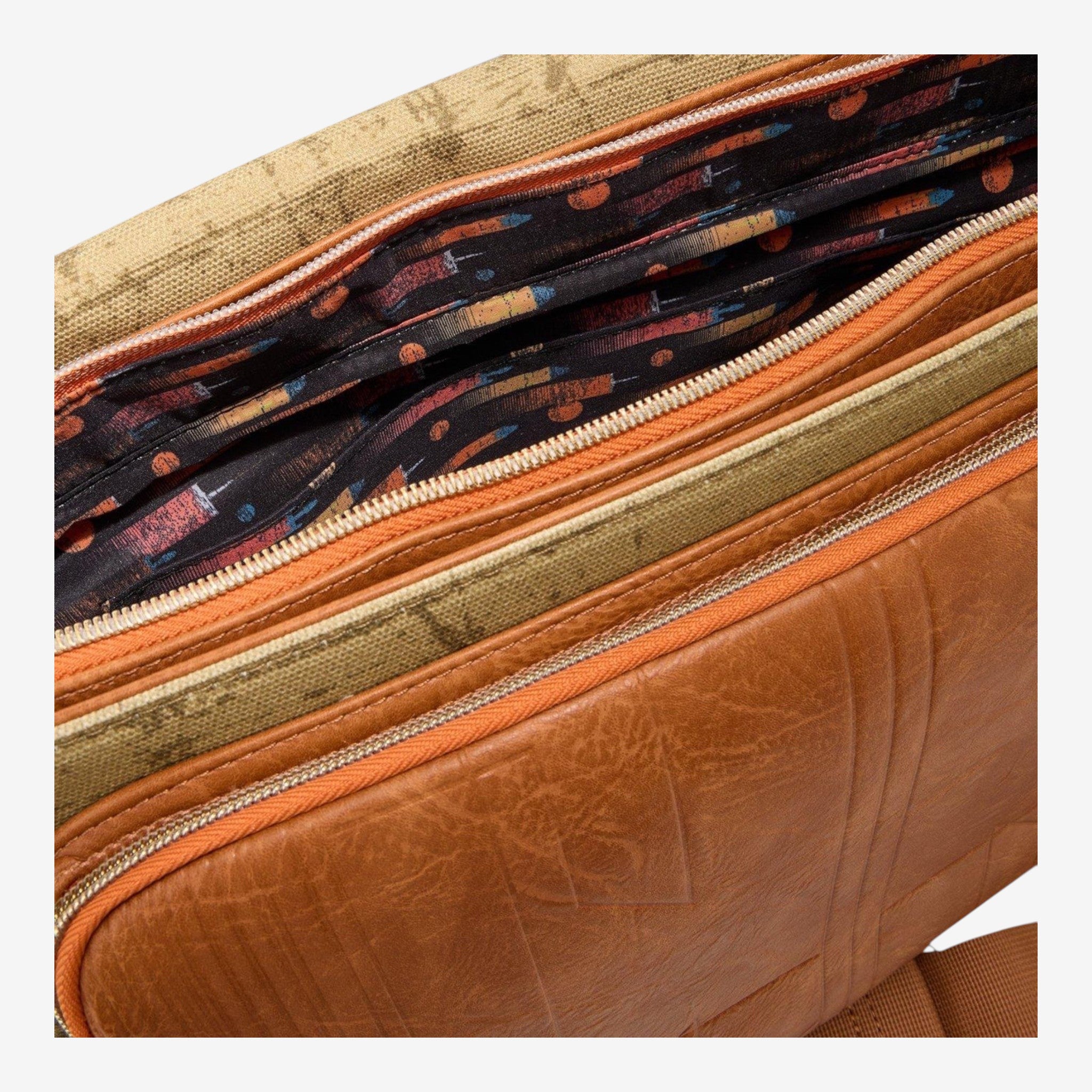 Once Upon Magic Star Wars X-Wing messenger bag, brown faux leather with vintage print lining and orange zippers.