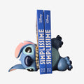 Once Upon Magic Disney Stitch bookend, blue resin, depicting Stitch lying down with a mischievous smile, holding books.