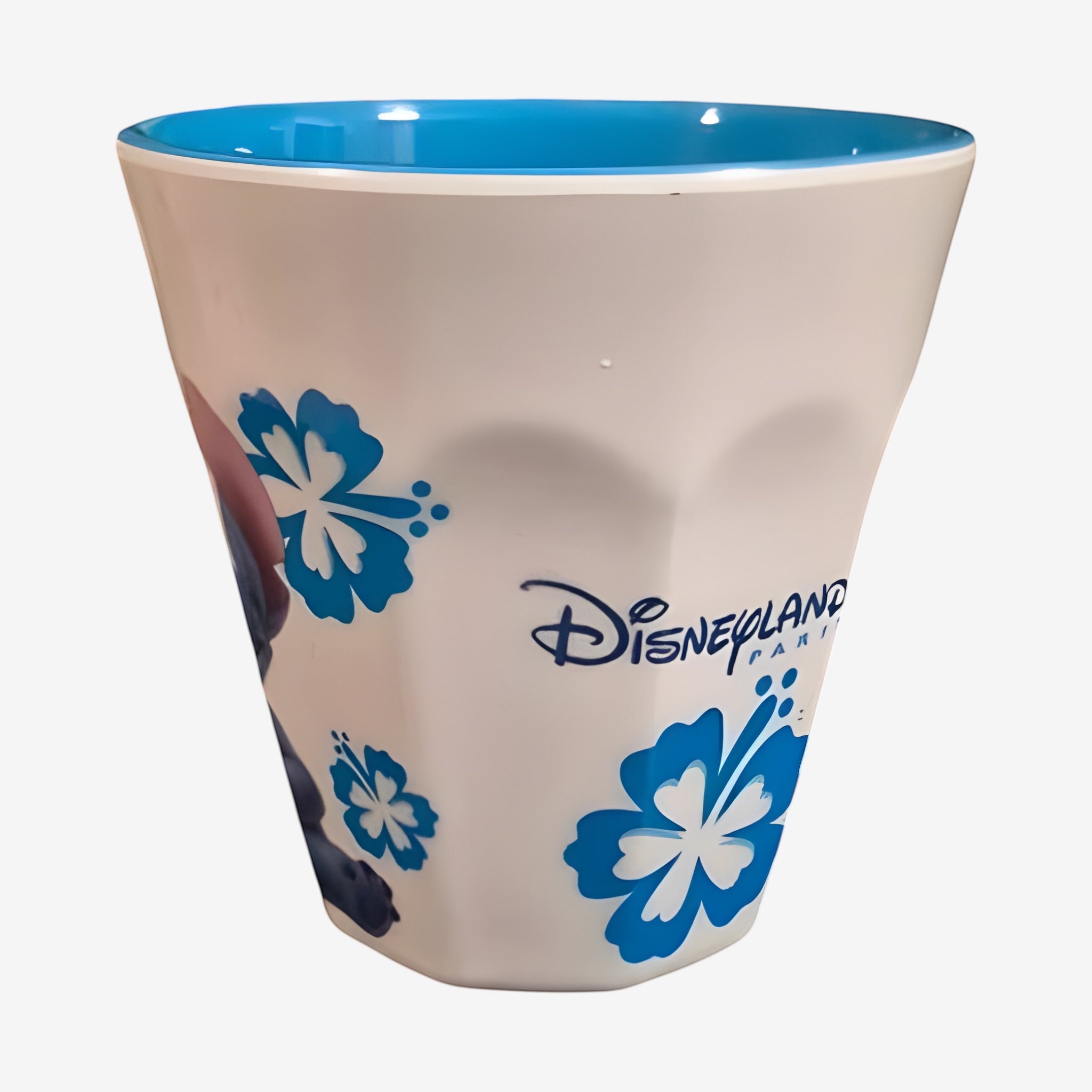 Once Upon Magic white hard plastic children's cup with blue Stitch character and hibiscus flowers. Disneyland Paris logo.