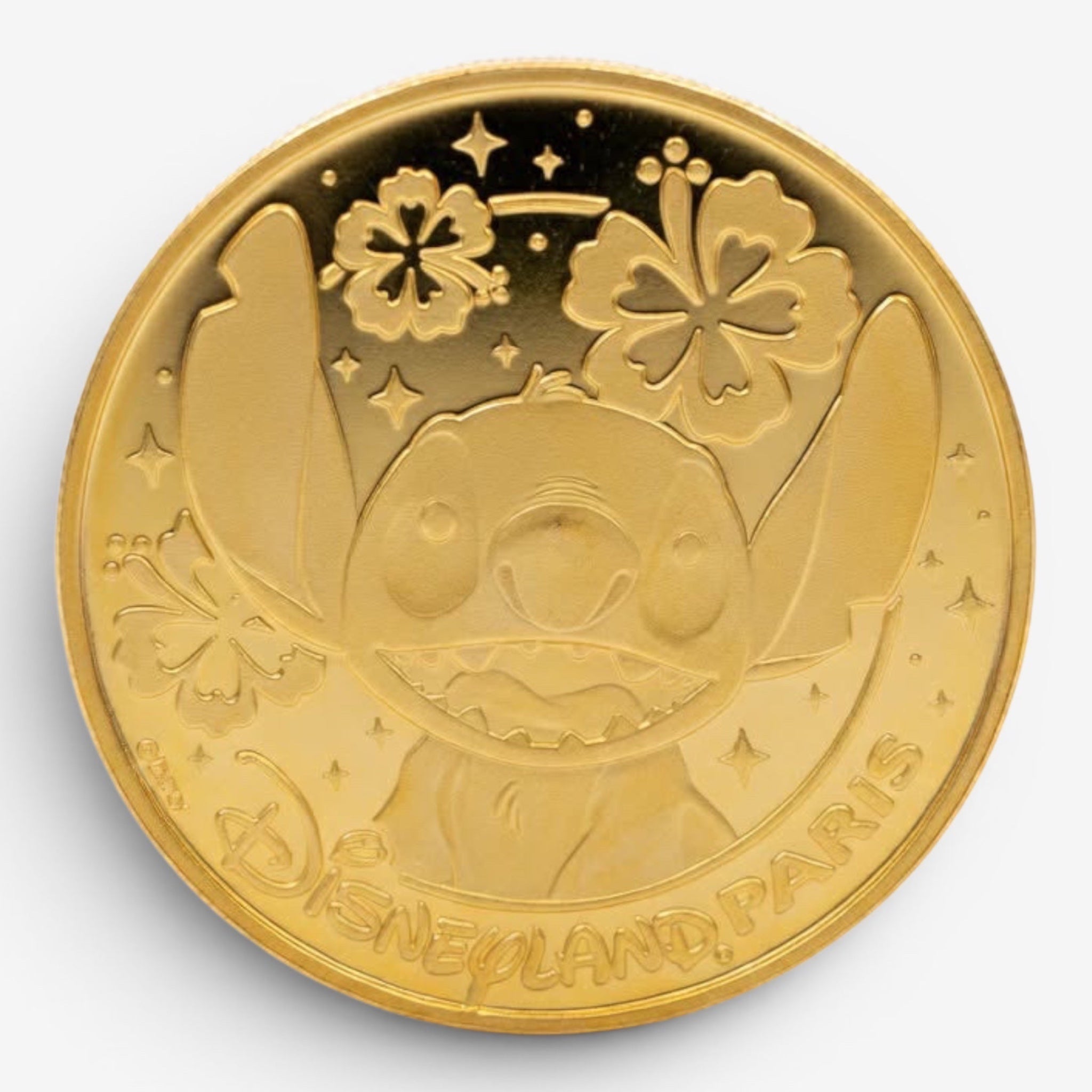 Once Upon Magic gold-tone Stitch coin medal featuring Stitch with flowers and stars, Disneyland Paris inscription.